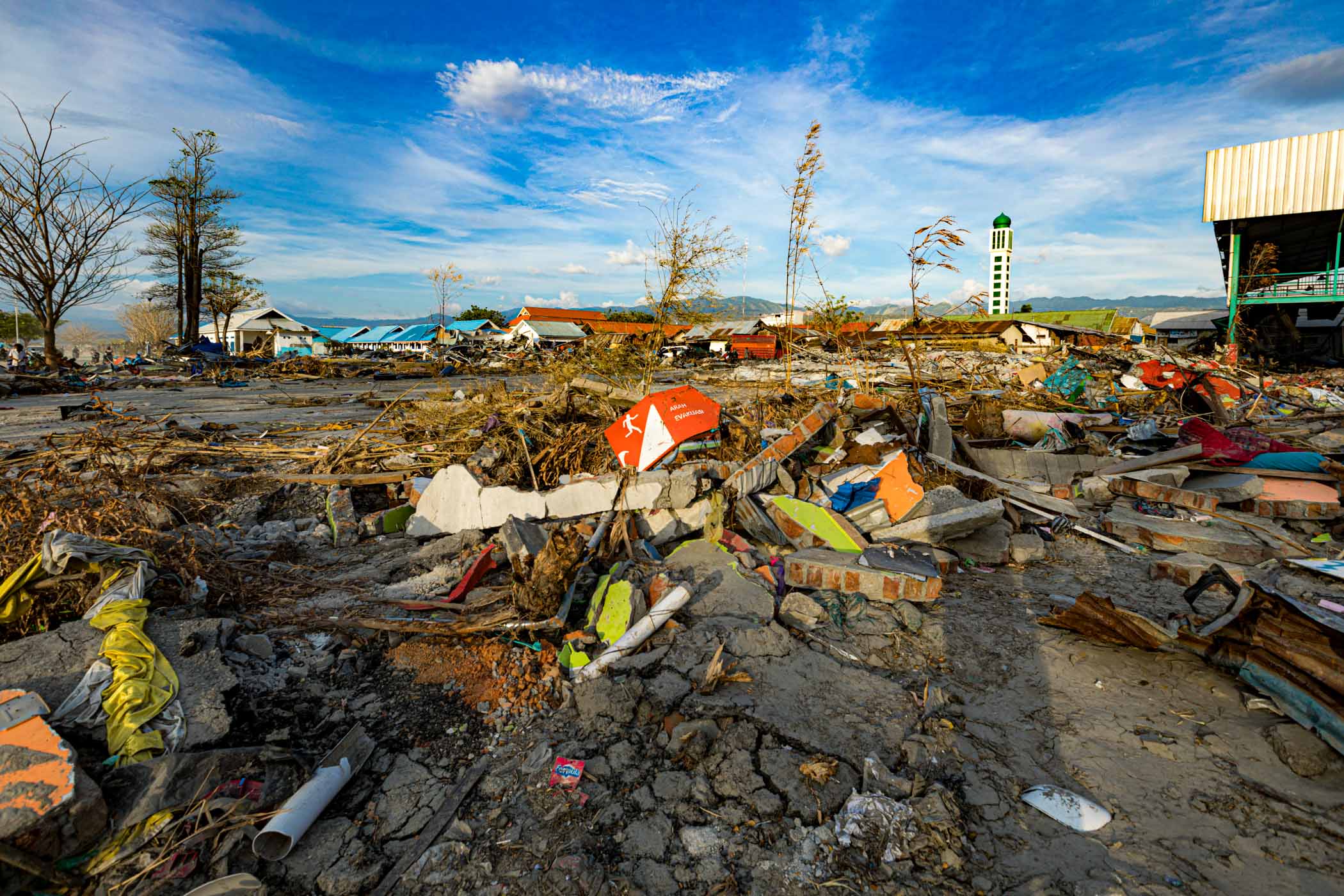 The scattered debris of buildings and cars after tsunami disaster swept Palu in 2018.